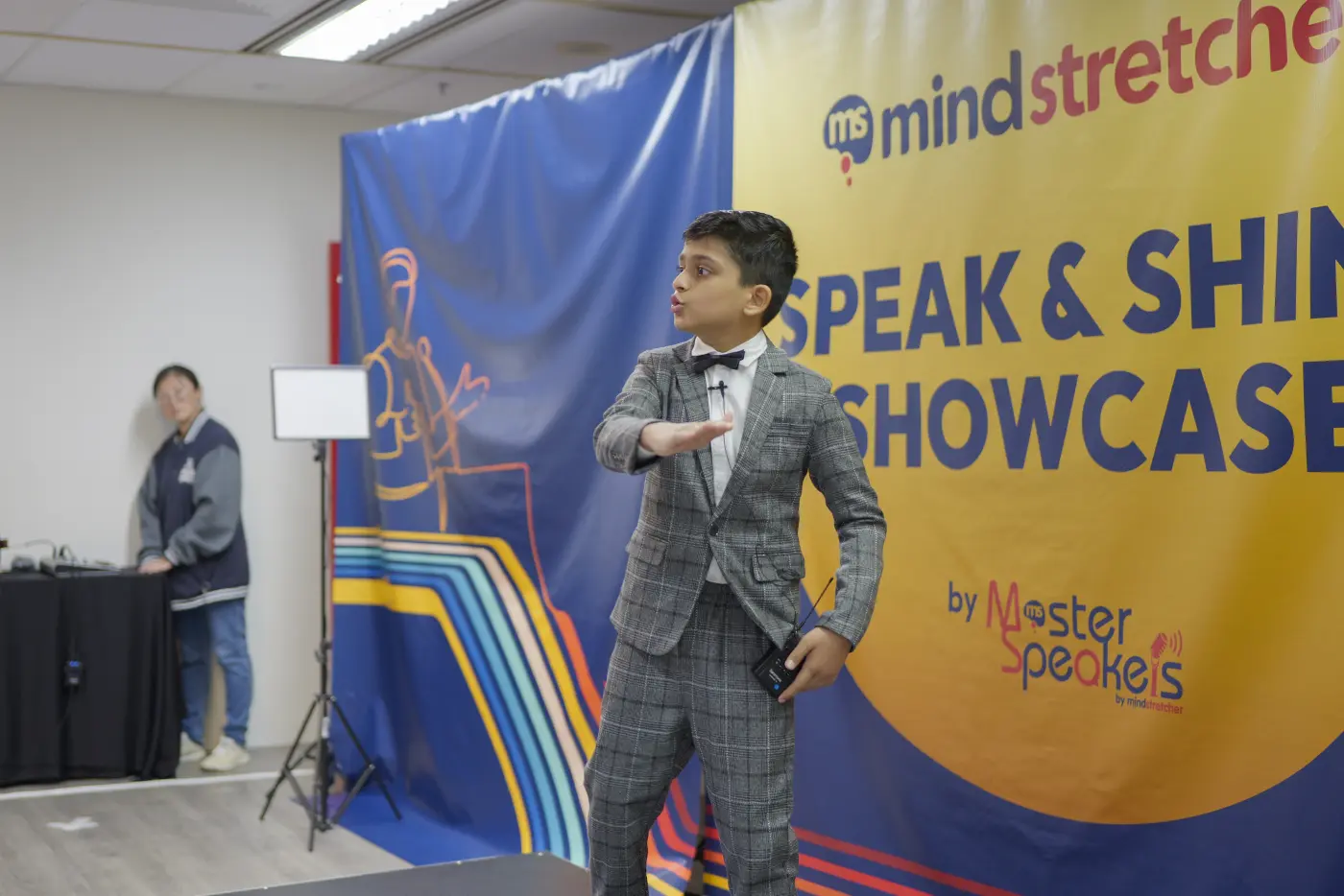 A student speaking at the showcase