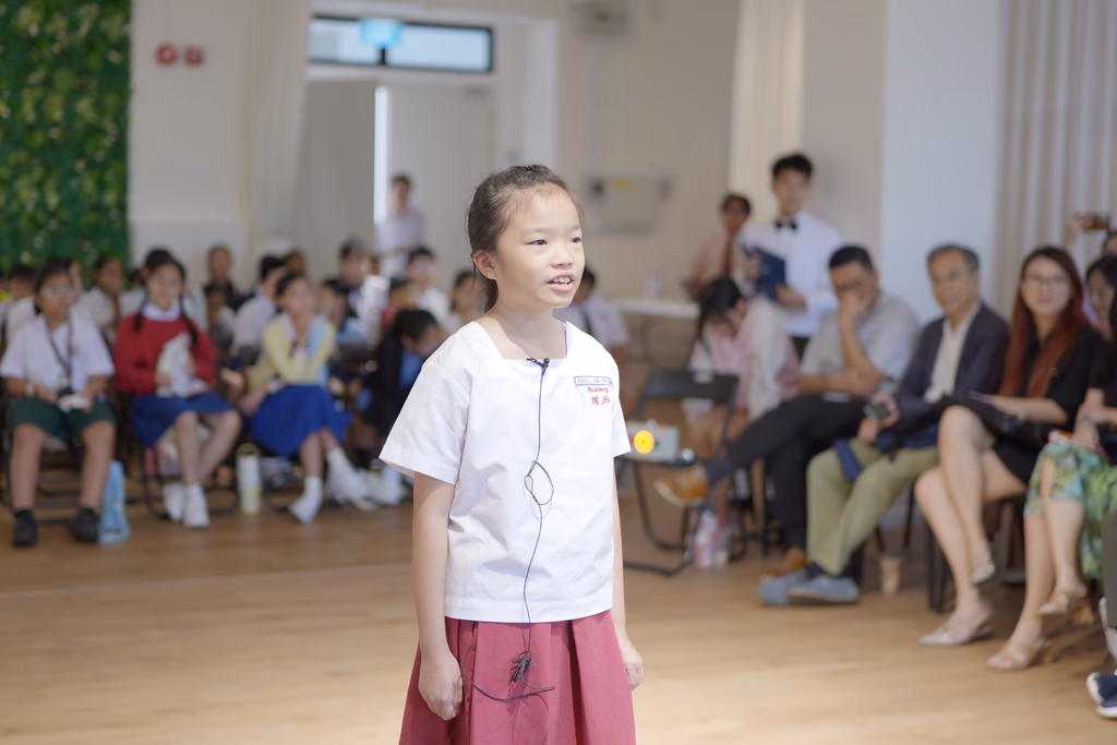 Young primary student delivering a story to an audience