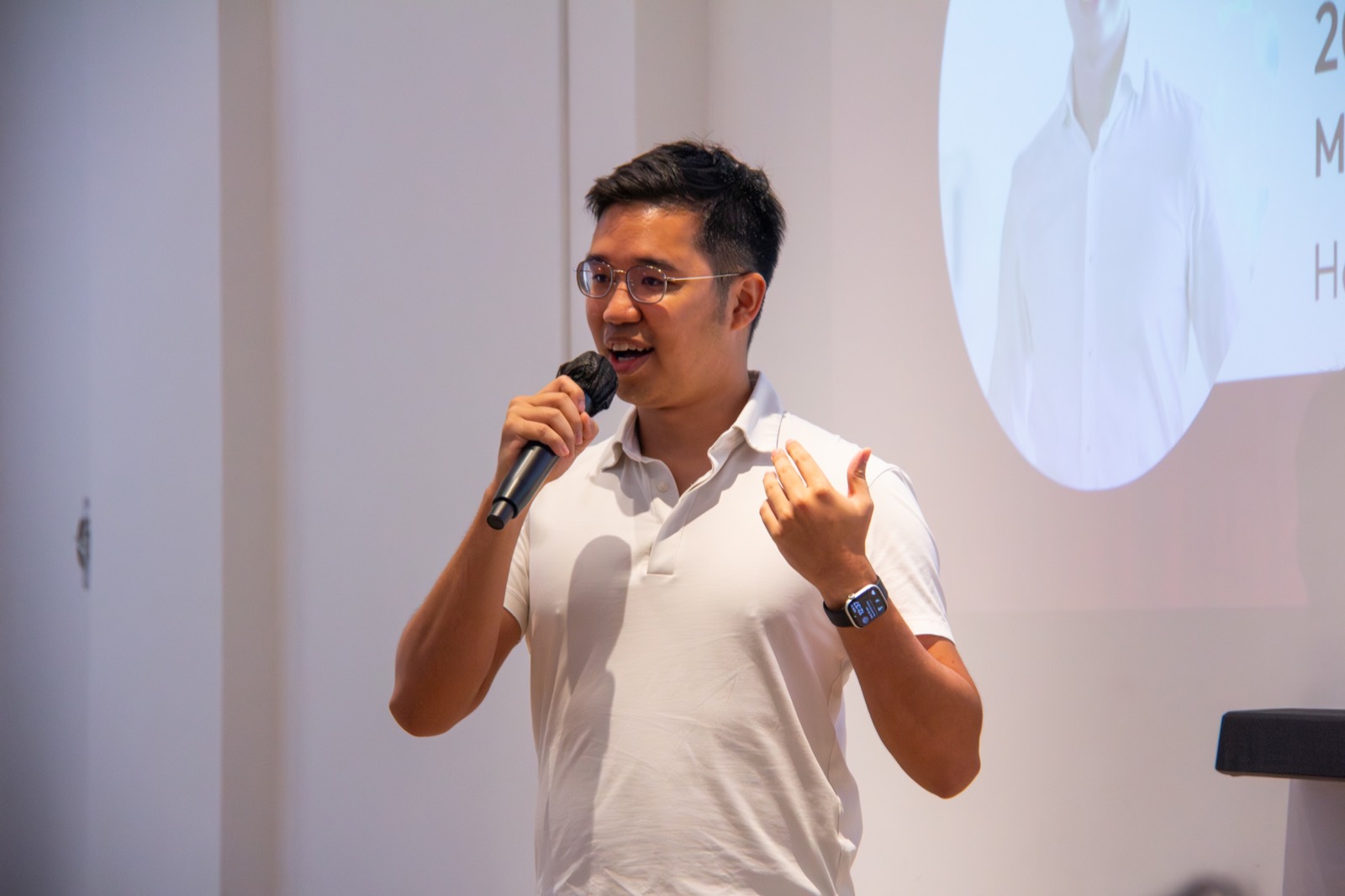 A mentor speaking on stage