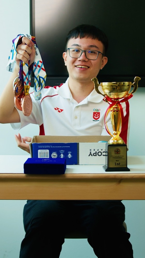 Grandmaster Tin Jingyao with his medals and trophy