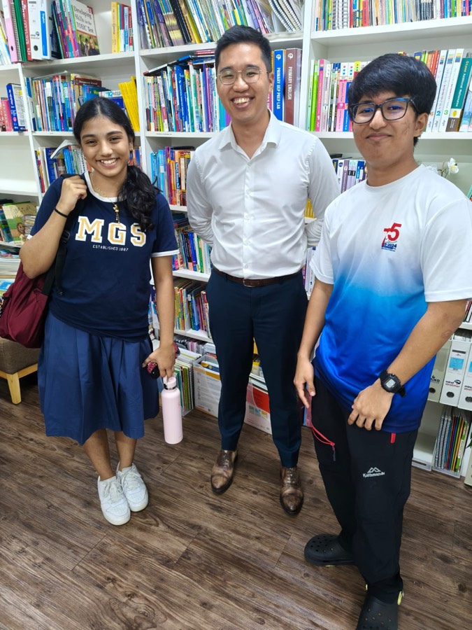 A mentor with students at an event