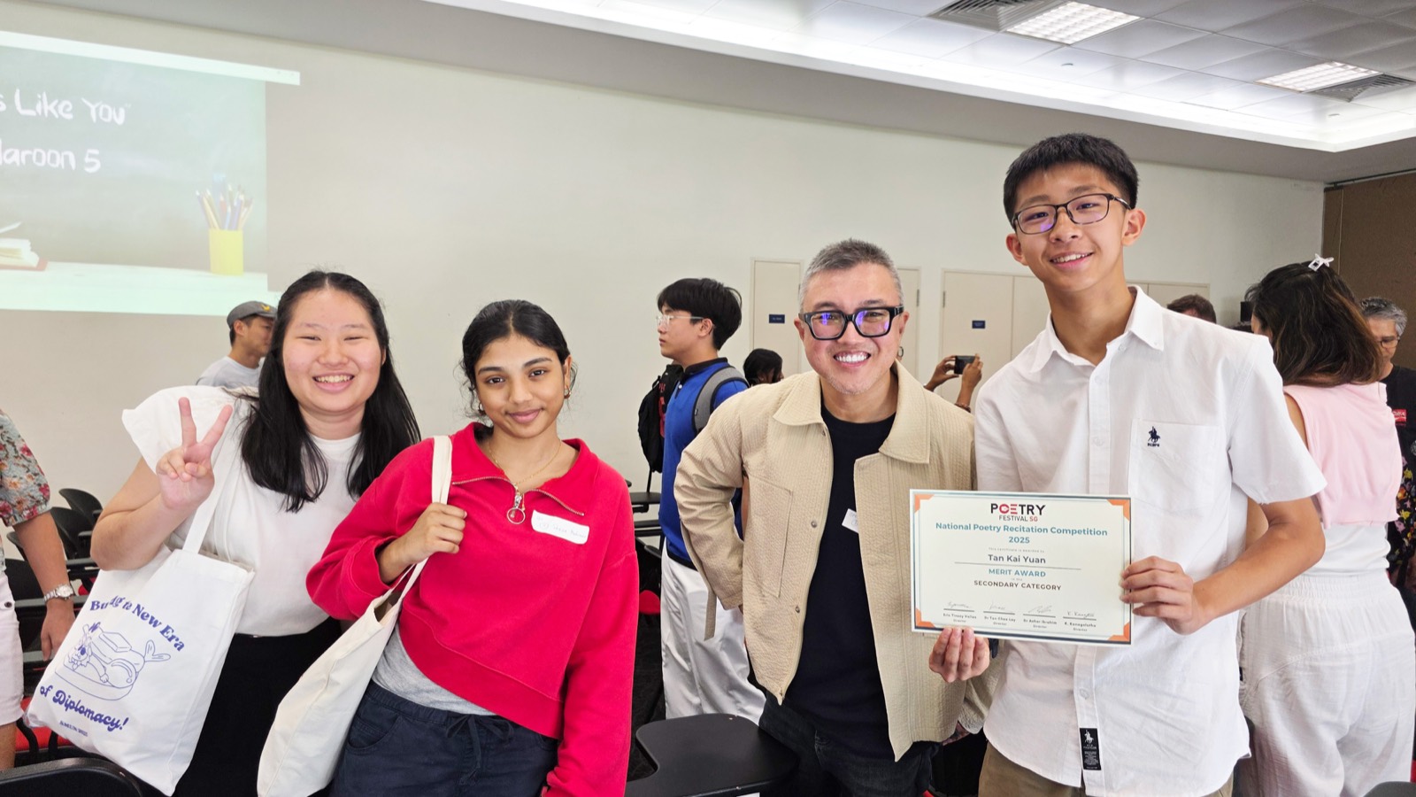 A mentor with students after a competition